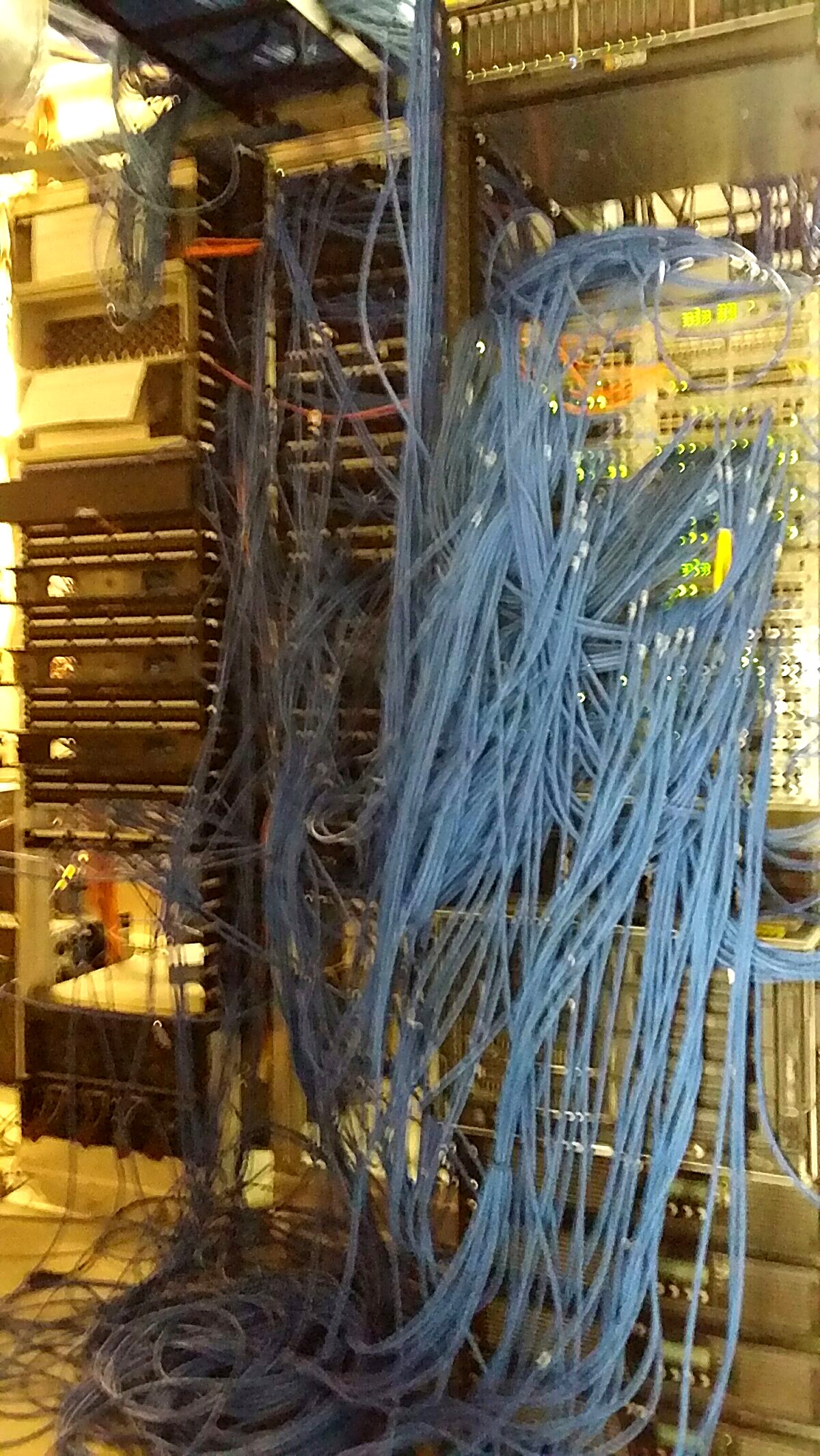 Disorganized, tangled network cabling in a server rack before Pine Cove cleanup